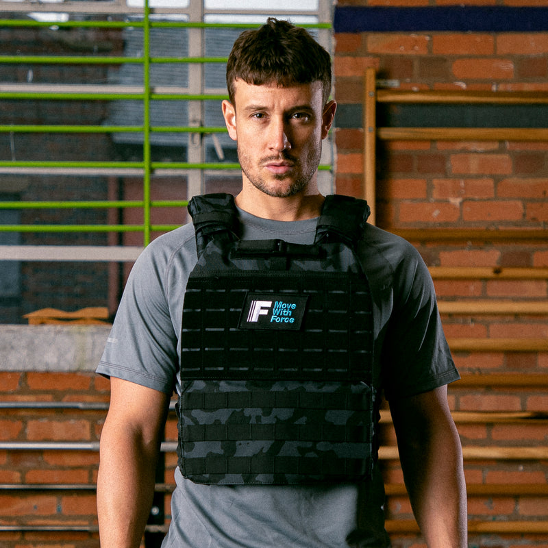male in black camo weighted vest